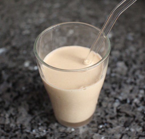 almond milk in a cup with straw
